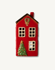 House with Christmas tree in front of house