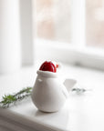 Ceramic bird with red hat