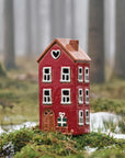 Ceramic House sleigh by the door