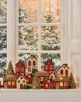 House with Christmas tree in front of house