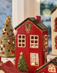 House with Christmas tree in front of house