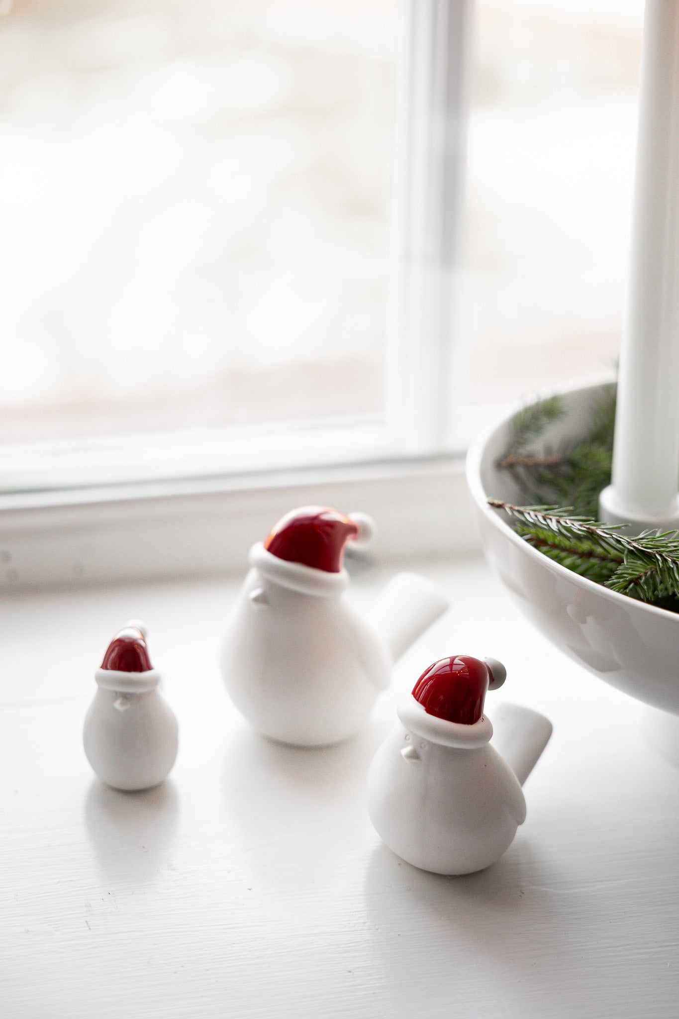 Ceramic bird with red hat
