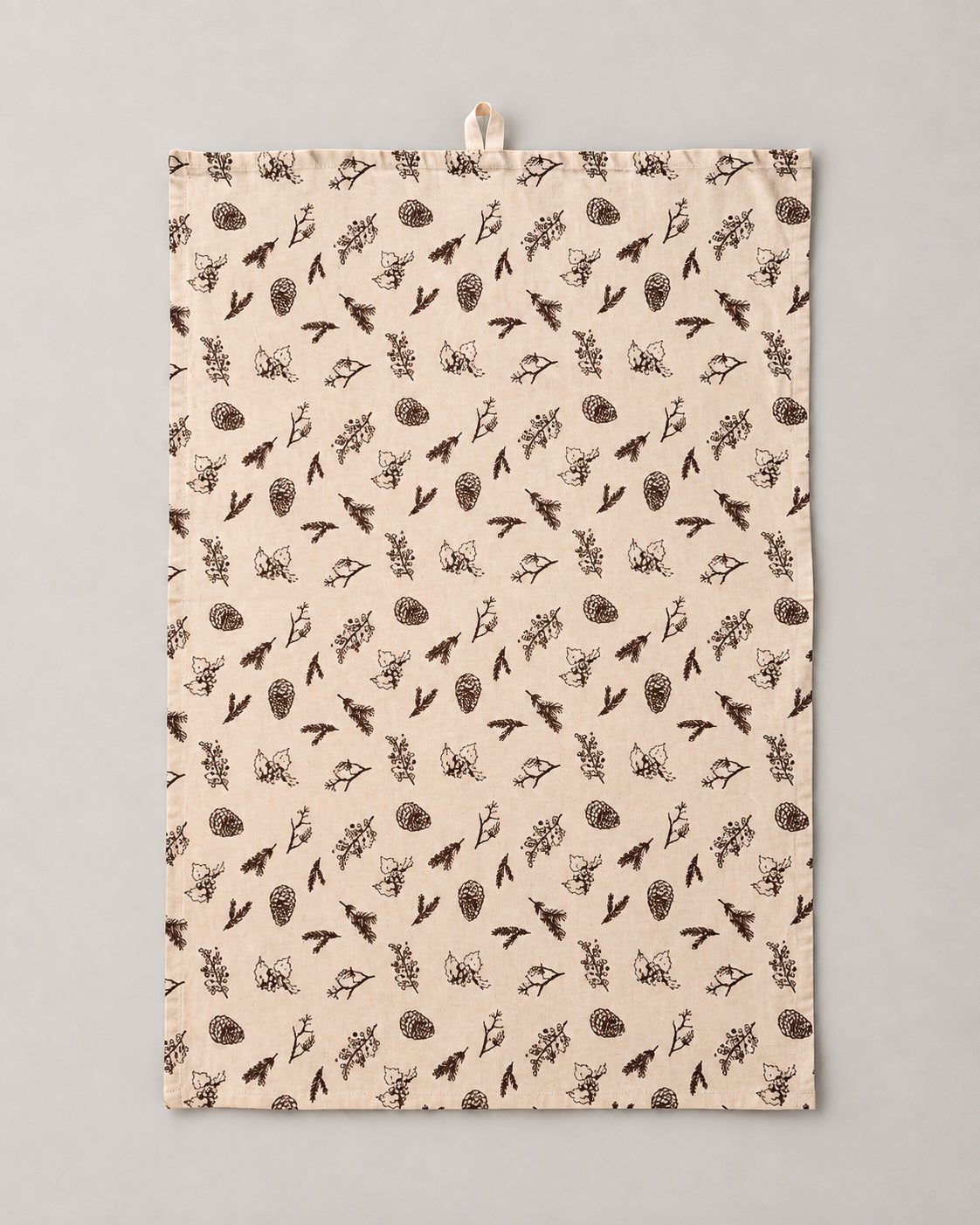 Tea towel with brown cones and twigs