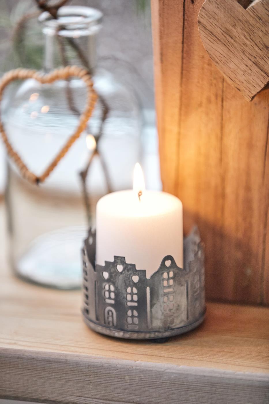 Candle holder punched houses