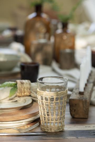 Drinking glass with straw weaving